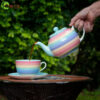 rainbow tea pot pastel pouring into breakfast cup