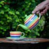 rainbow tea pot pouring into breakfast cup 1