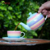 rainbow tea pot pastel pouring into breakfast cup 1